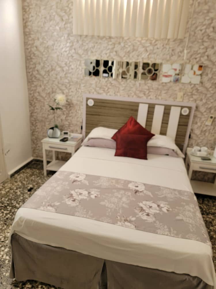 Double bedroom with bedside tables and a tea tray