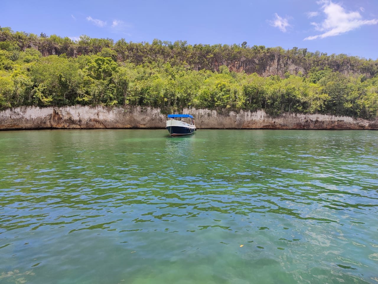 Dive boat in a Guajimico cove