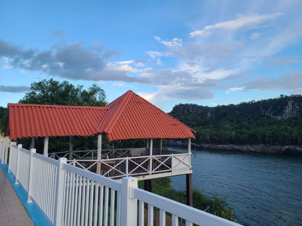 Red-roof pavilion overlooking the water